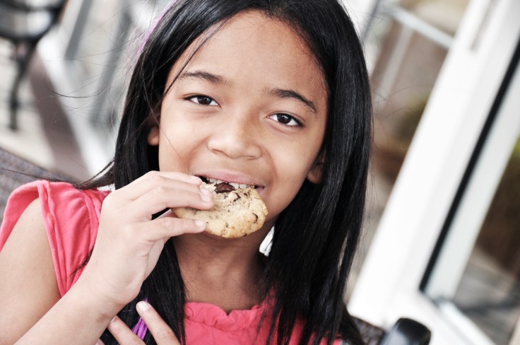 girl eating a cookie