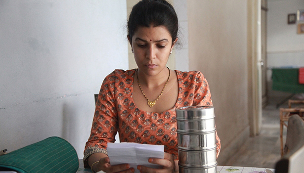 Ila reading her note