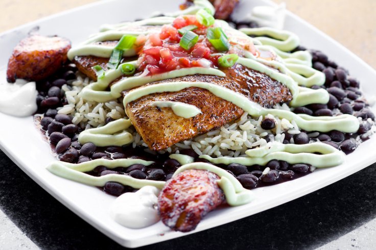 Blackened Dolphin Avocado served with black beans, rice and our cilantro avocado cream topped with fresh salsa