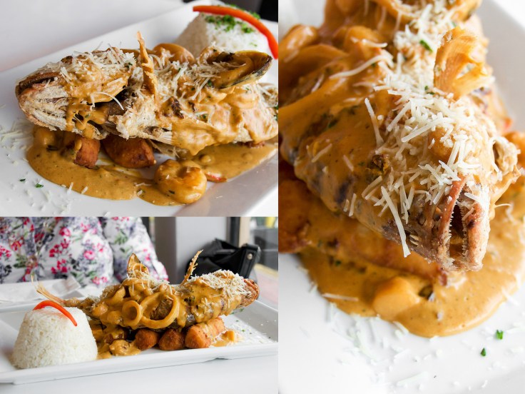 Fried Snapper with Seafood Cream Sauce sprinkled with Parmesan cheese